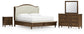 Sturlayne California King Upholstered Panel Bed with Mirrored Dresser and Nightstand